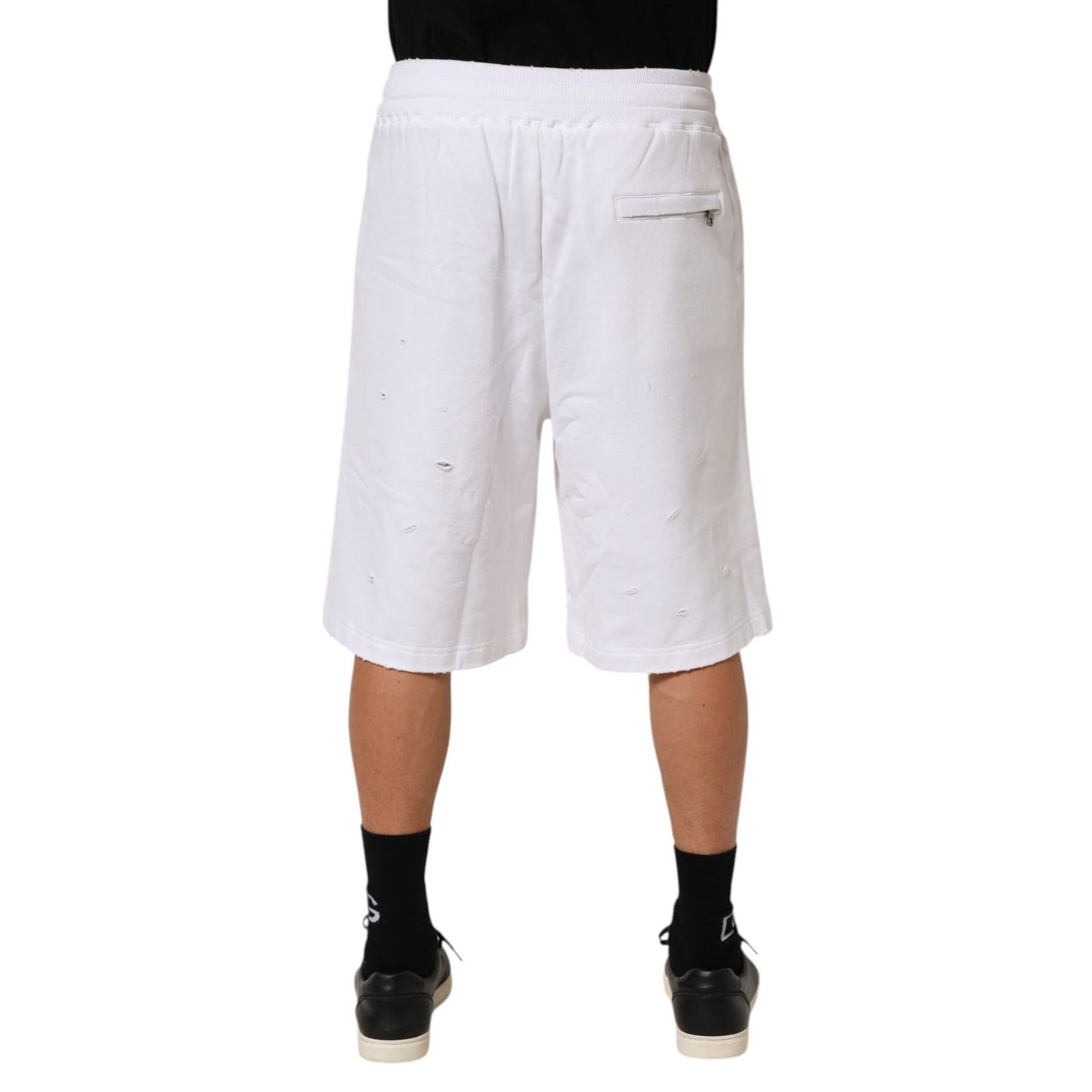 Back view of Dolce & Gabbana White Cotton Ripped Bermuda Sweatpants Shorts showcasing relaxed fit and elastic waistband.