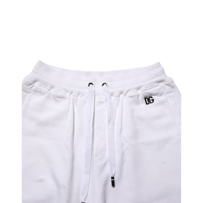 Dolce & Gabbana White Cotton Ripped Bermuda Sweatpants Shorts with elastic waistband and drawstring.
