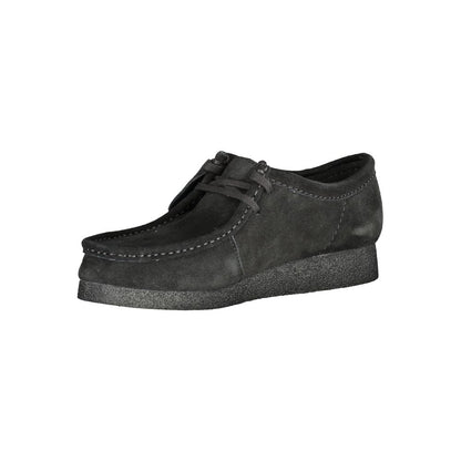 Clarks Black Leather Men Sneaker with suede finish and removable footbed, showcasing sleek design and iconic Clarks logo.