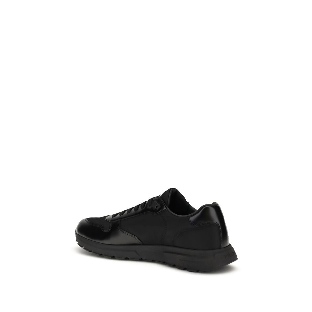 Prada Black Recycled Polyamide Athletic Sneakers, side view of Prax 01 with enameled logo, lightweight sole, and leather footbed.