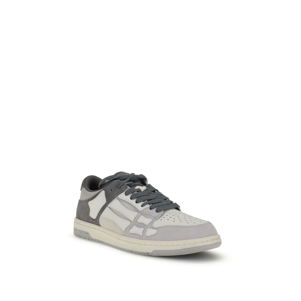 Amiri Gray Calf Leather Bos Taurus Low Top Sneakers with bone appliqués on rubber sole.