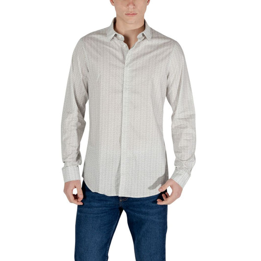 Man wearing Armani Exchange Cream Cotton Pattern Shirt with geometric design, classic collar, and button closure.