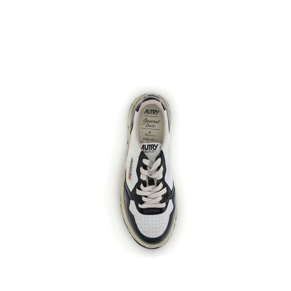 Autry Cream Leather Athletic Sneakers top view with white and black leather, perforated toe, and lace-up closure from Mihara Yasuhiro collection