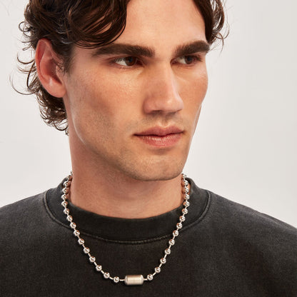 Gent wearing BREIL JEWELS Mod. TJ3668 silver necklace in official box with 5 ATM water resistance and chronograph function.