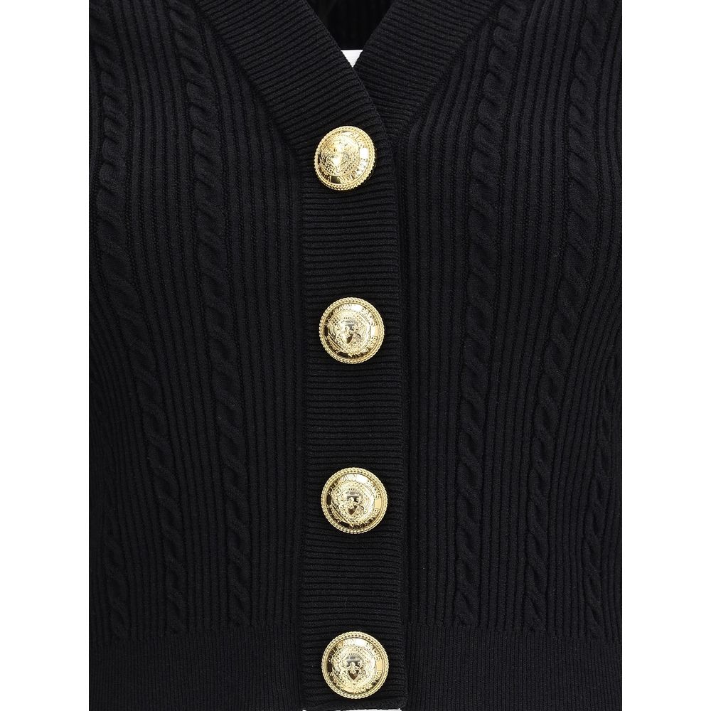Balmain Black Viscose Cardigan with ribbed design and gold embossed buttons, showcasing structured shoulders and military-inspired tabs.