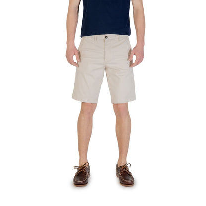 Man wearing Borghese Bicolor Cotton Bermuda Shorts paired with a navy shirt and brown shoes.