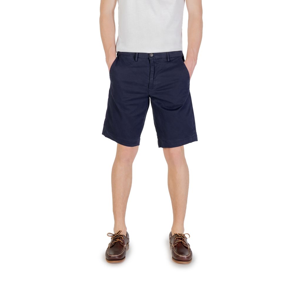 Man wearing Borghese Blue Cotton Bermuda Shorts for casual summer style