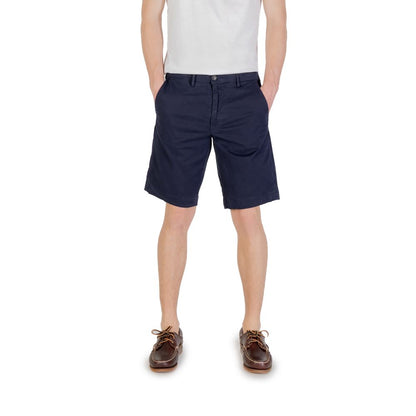 Man wearing Borghese Blue Cotton Bermuda Shorts for casual summer style