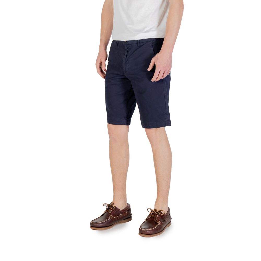 Model wearing Borghese Blue Cotton Bermuda Shorts with casual shoes.