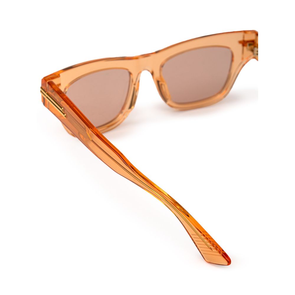 Bottega Veneta Orange Acetate Sunglass with transparent frame and orange lenses featuring gold temple details