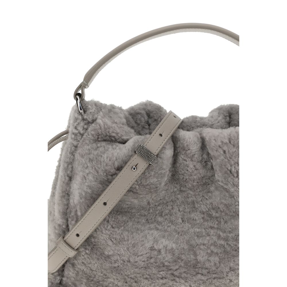 Close-up of Brunello Cucinelli Gray Fur Shoulder Bag featuring soft shearling, drawstring closure, and adjustable strap.