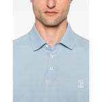 Brunello Cucinelli Polo shirt with embroidery in light blue cotton, featuring short sleeves, button placket, and embroidered logo detail.