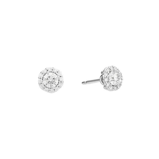 Exquisite diamond stud earrings with halo design on white background, showcasing brilliance and elegance.
