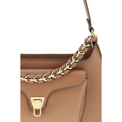 Coccinelle Beige Calf Leather Bos Taurus Shoulder Bag with gold chain handle and pocket detail.