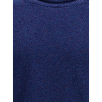 Comme Des Garçons Blue Wool Sweatshirt with ribbed knit texture, featuring a round neckline and long sleeves for a contemporary elegant style.