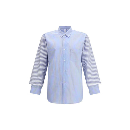 Comme Des Garçons Light Blue Cotton Pattern Shirt with subtle stripes and double cuffs, avant-garde design with a modern, elegant style.