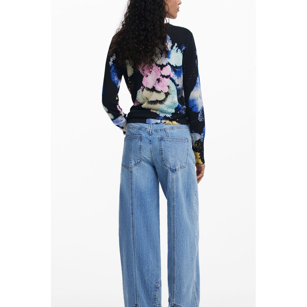 Back view of Desigual Black Linen Women Sweater with colorful pattern, worn by a model with denim jeans.