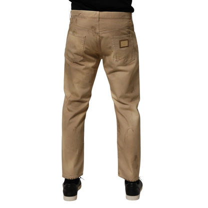 Back view of Dolce & Gabbana Beige Cotton Loose Tattered Men Denim Jeans with relaxed fit and distressed details.