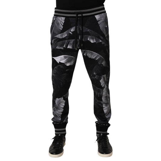 Dolce & Gabbana Black Banana Leaf Cotton Jogger Trouser Pants with elastic waistband and ribbed cuffs.