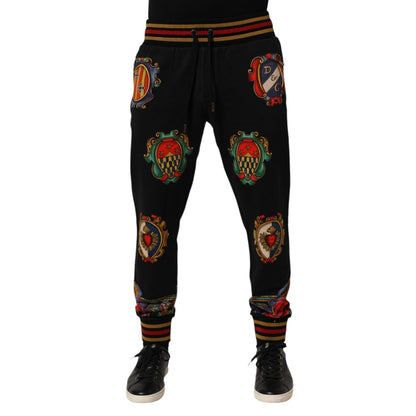 Dolce & Gabbana Black Baroque Crest Logo Men Trackpants Pants with embroidered details and ribbed cuffs for luxury and comfort.