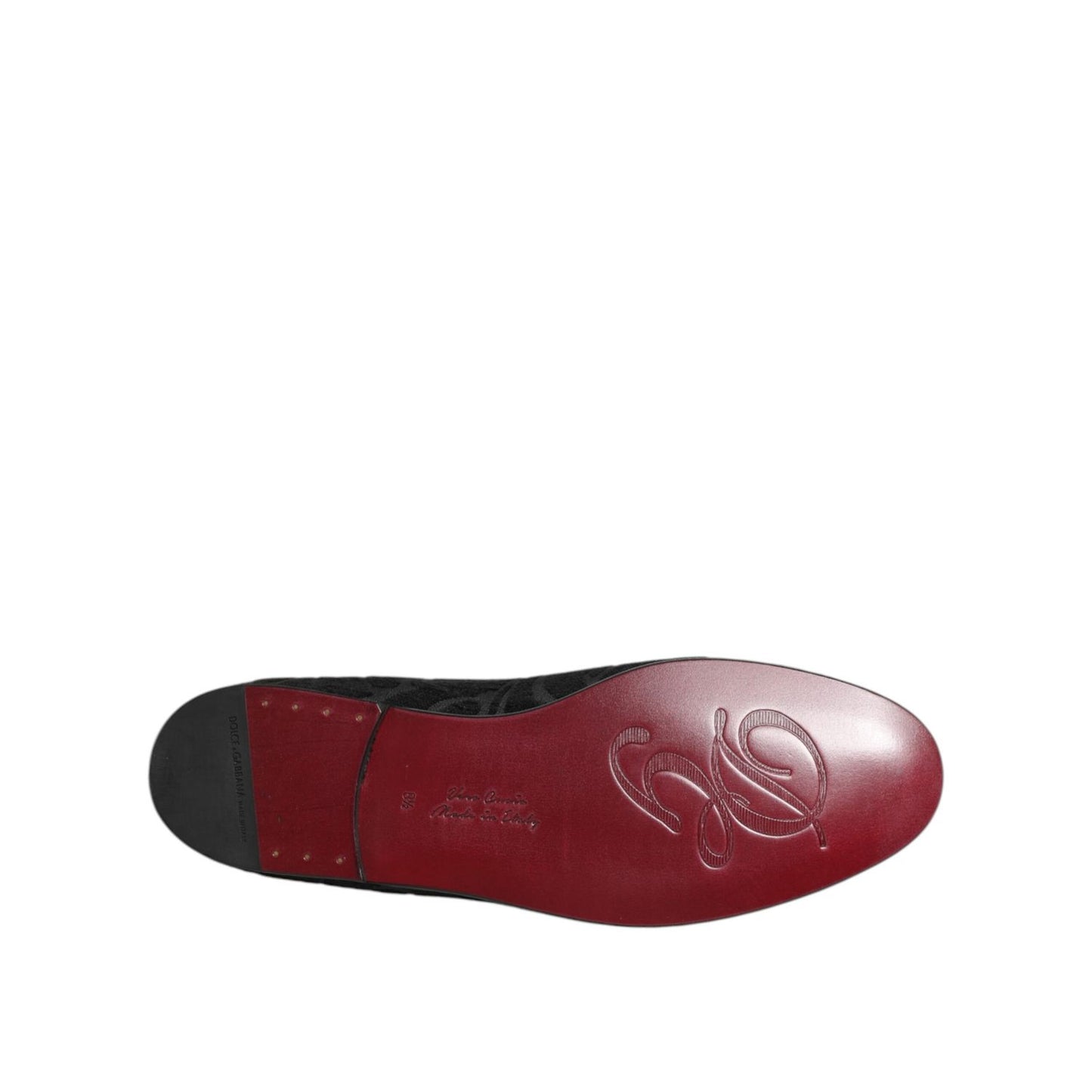 Sole view of Dolce & Gabbana Black Brocade Loafers Slip On Men Dress Shoes, featuring embossed logo and red finish for a sophisticated touch.