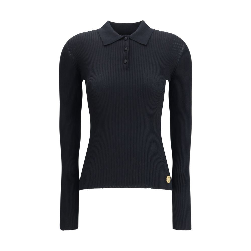Dolce & Gabbana Black Cashmere Polo Shirt with ribbed design, classic collar, and three-button closure for elegant and versatile style.