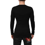 Rear view of model wearing Dolce & Gabbana Black Cotton Button Up Men Cardigan Sweater, highlighting sleek, form-fitting design and black color.