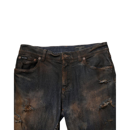 Dolce & Gabbana Black Cotton Skinny Tattered Men Denim Jeans with worn-in look and edgy style.