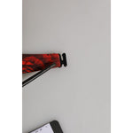 Red strap detail of bra with black hook closure on white background.