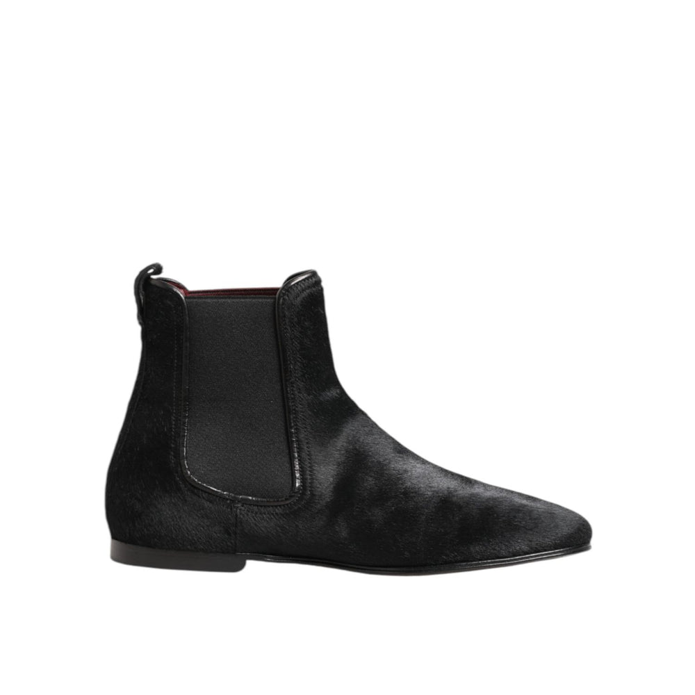 Dolce & Gabbana Black Leather Fur Men CHELSEA Boots Shoes with elastic side panels and plush fur lining, side view.