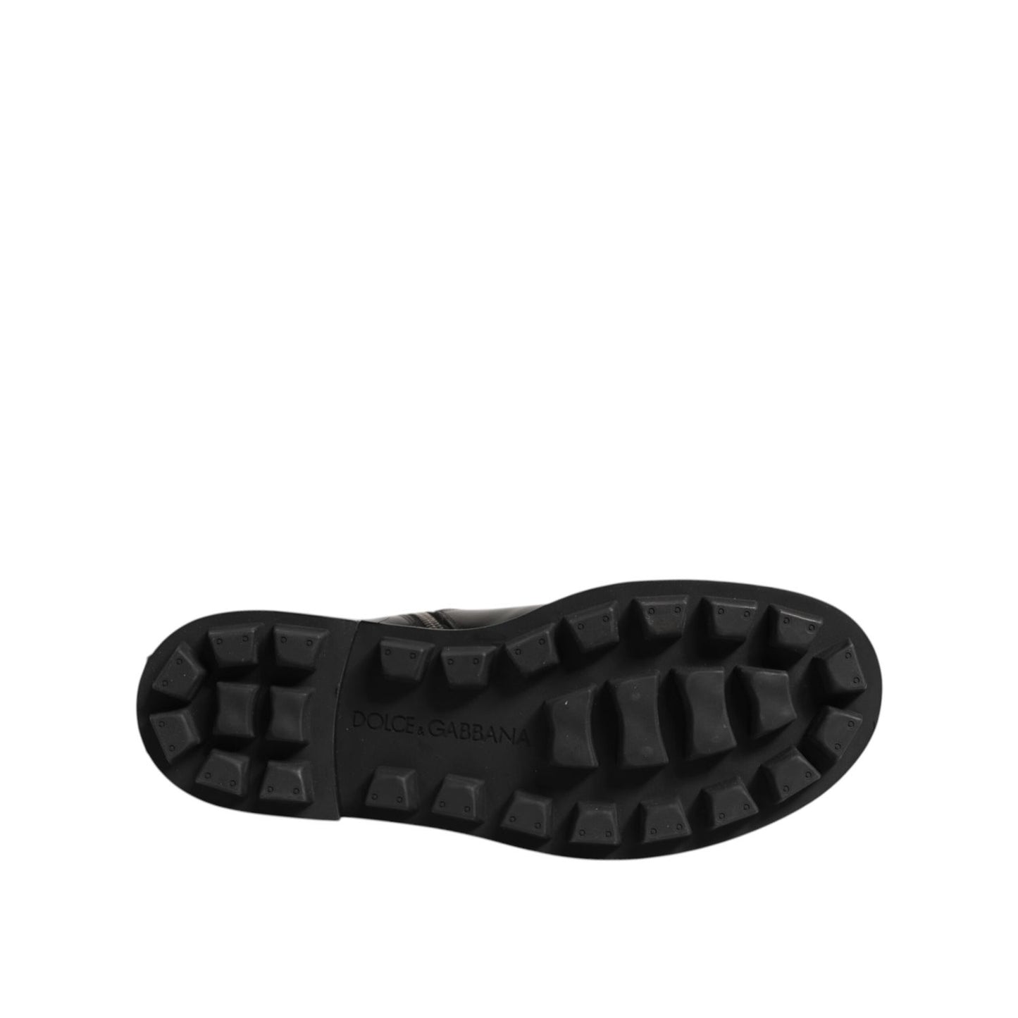 Sole view of Dolce & Gabbana Black Logo Plaque Mid Calf Biker Boots Shoes showcasing rugged grip design.