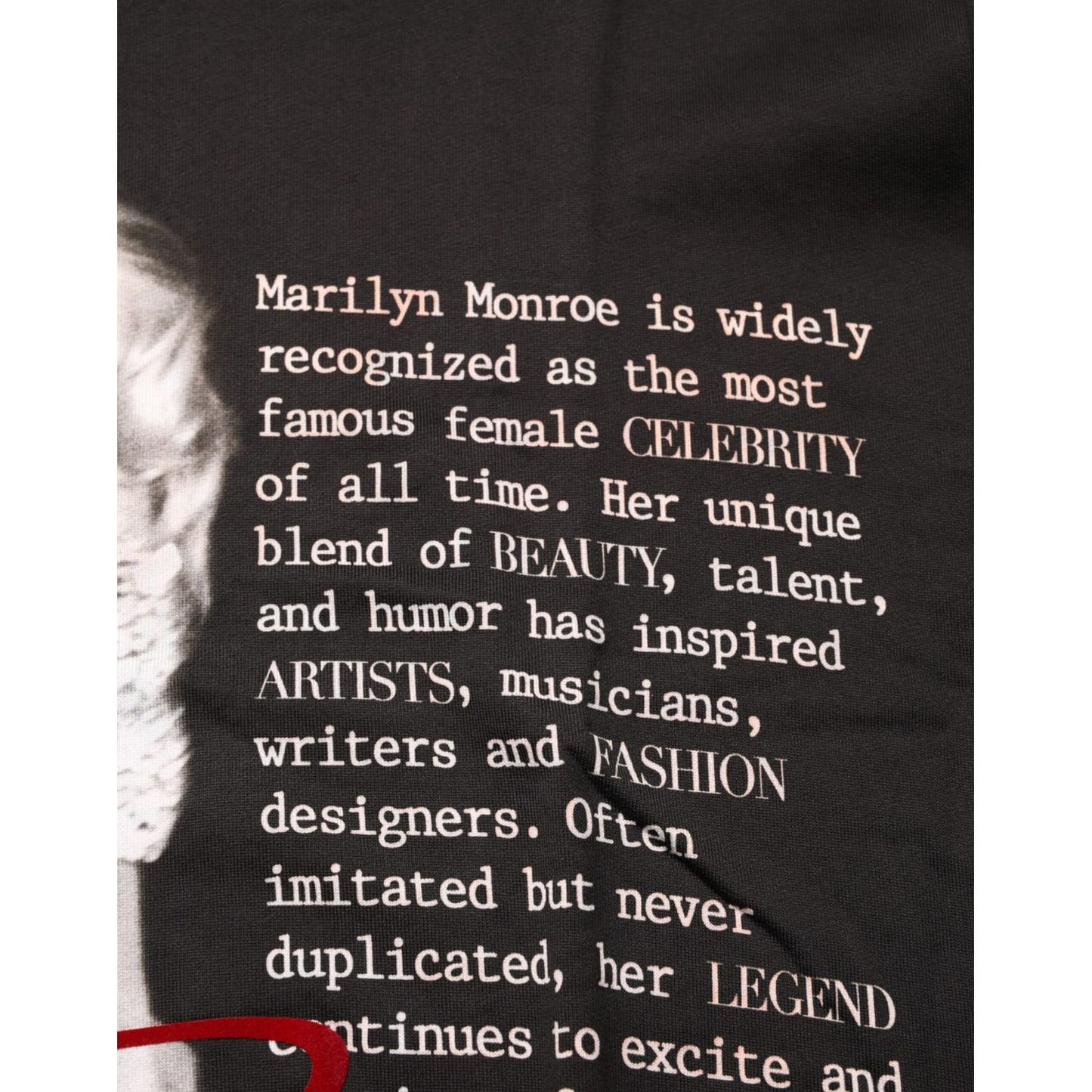 Text on Dolce & Gabbana Black Marilyn Monroe Cotton Crew Neck T-shirt with a Marilyn Monroe portrait, focusing on her iconic influence.