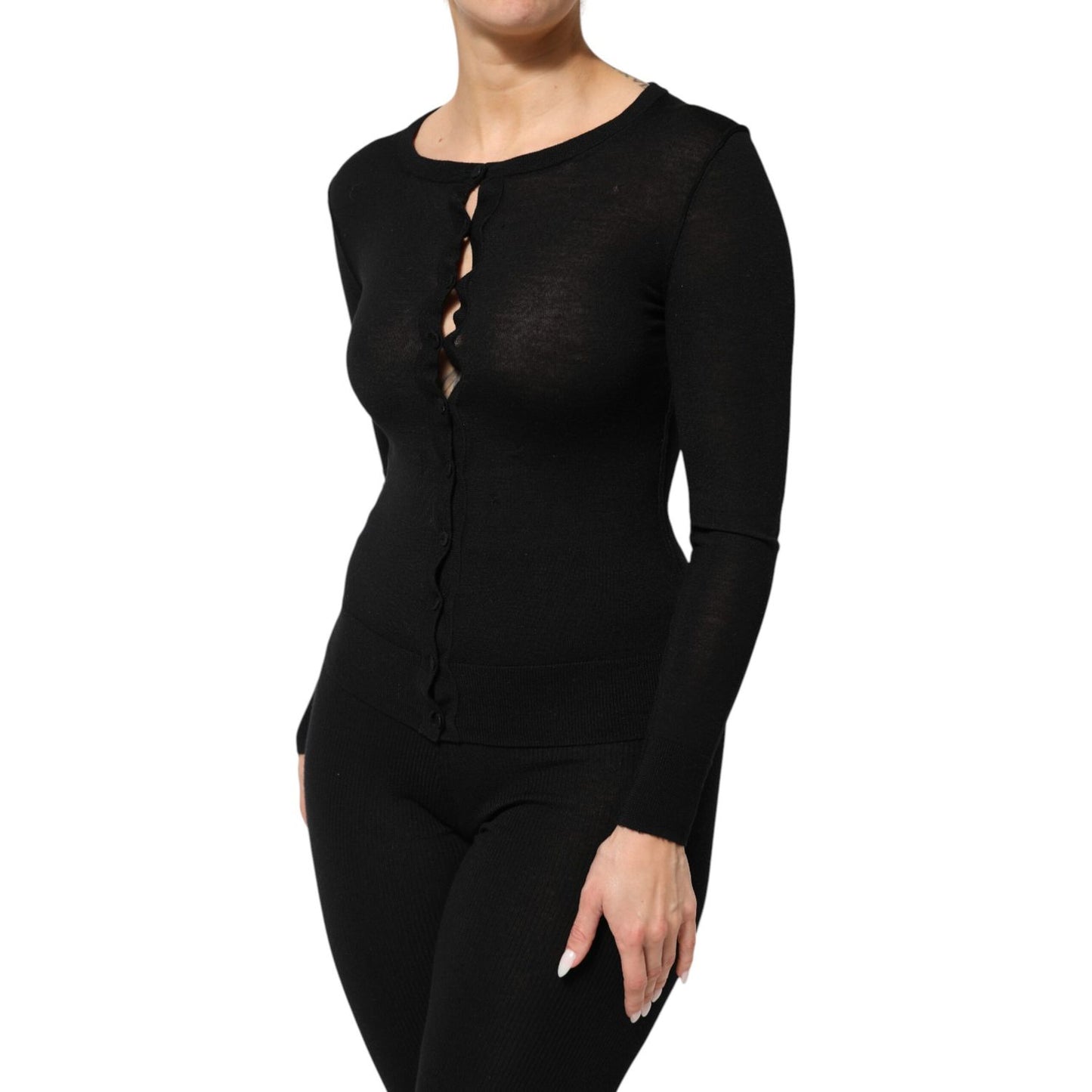 Dolce & Gabbana Black Virgin Wool Buttoned Cardigan Sweater with a classic design and ribbed cuffs, perfect for layering elegance.