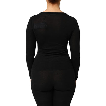 Back view of Dolce & Gabbana Black Virgin Wool Buttoned Cardigan Sweater showcasing ribbed design and elegant silhouette.