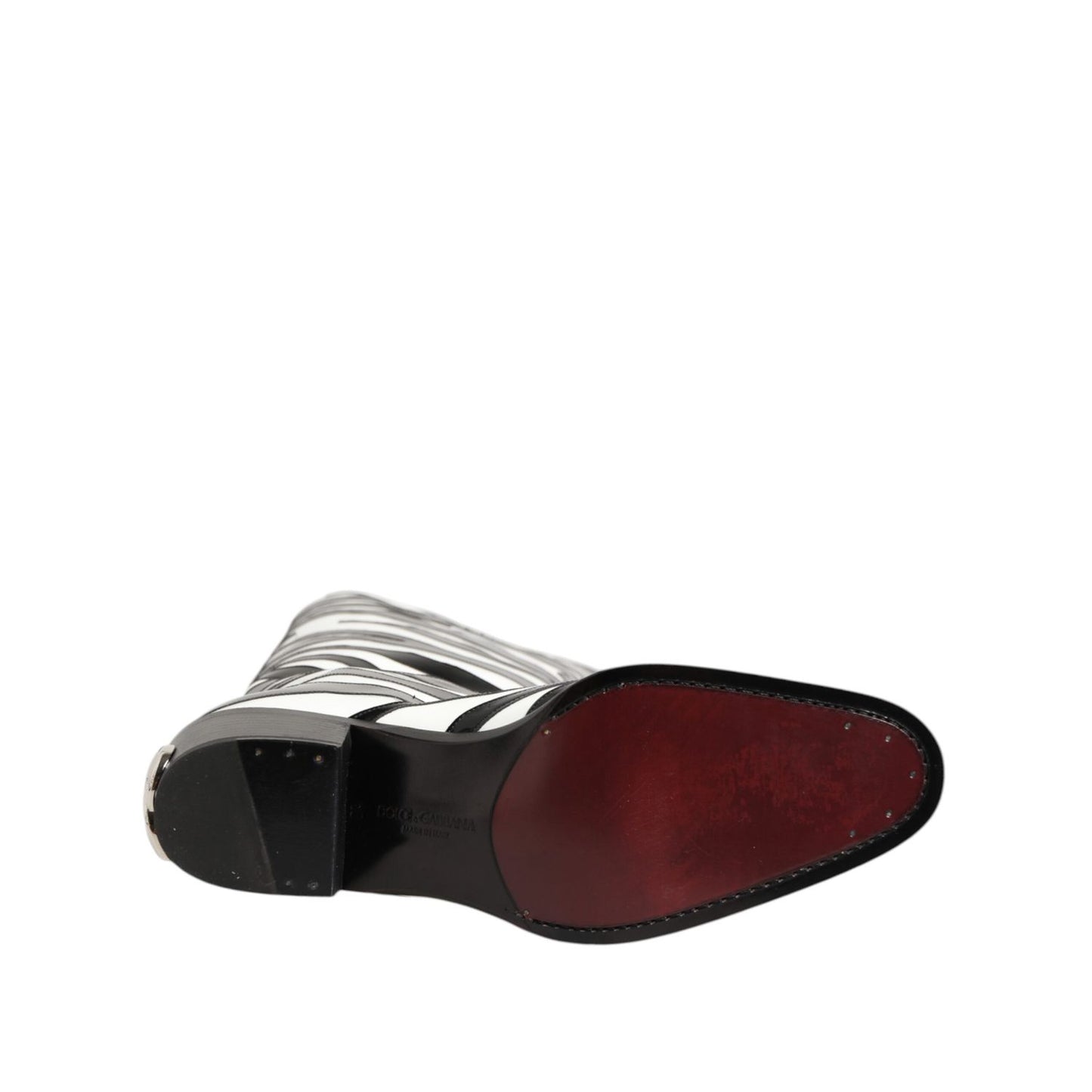 Sole view of Dolce & Gabbana Black White Zebra Over The Calf Boots Shoes, showcasing the unique sole design and zebra pattern.