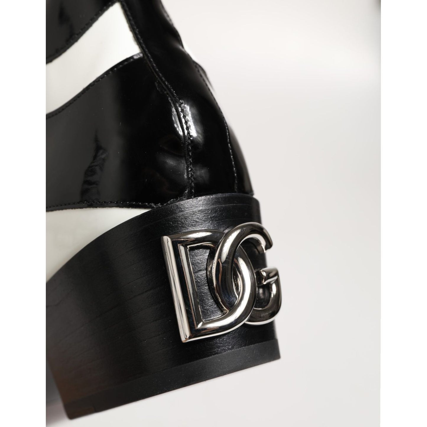 Dolce & Gabbana Black White Zebra Over The Calf Boots Shoes with logo detail on the heel, showcasing sleek black and white pattern.