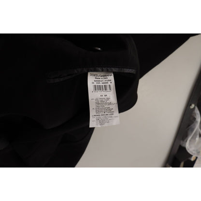 Label of Dolce & Gabbana Black Wool Single Breasted Coat Blazer featuring material and care details.