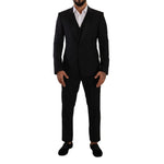 Dolce & Gabbana Black Wool Suits & Blazer with notch lapels and slim fit design.