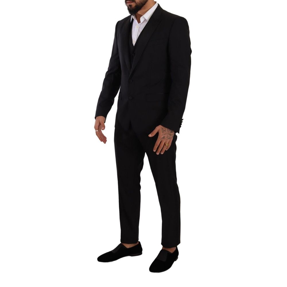 Model wearing Dolce & Gabbana Black Wool Suits & Blazer, slim fit, single-breasted with one button closure.