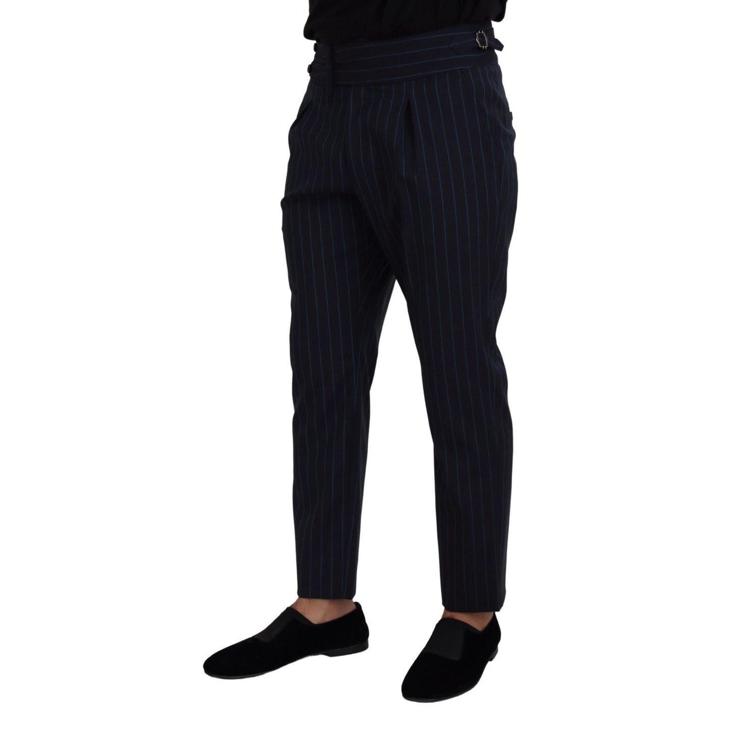 Model wearing Dolce & Gabbana Blue Striped Men Formal Pants made of 100% virgin wool, showcasing luxury and Italian craftsmanship.
