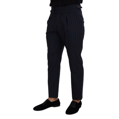 Model wearing Dolce & Gabbana Blue Striped Men Formal Pants made of 100% virgin wool, showcasing luxury and Italian craftsmanship.