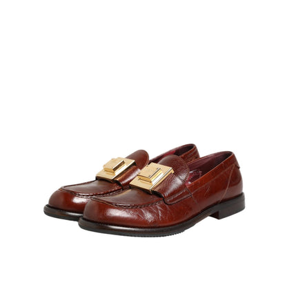 Dolce & Gabbana Brown Leather Logo Slip On Men Dress Shoes with gold buckle detailing, elegant and sophisticated design for formal wear.