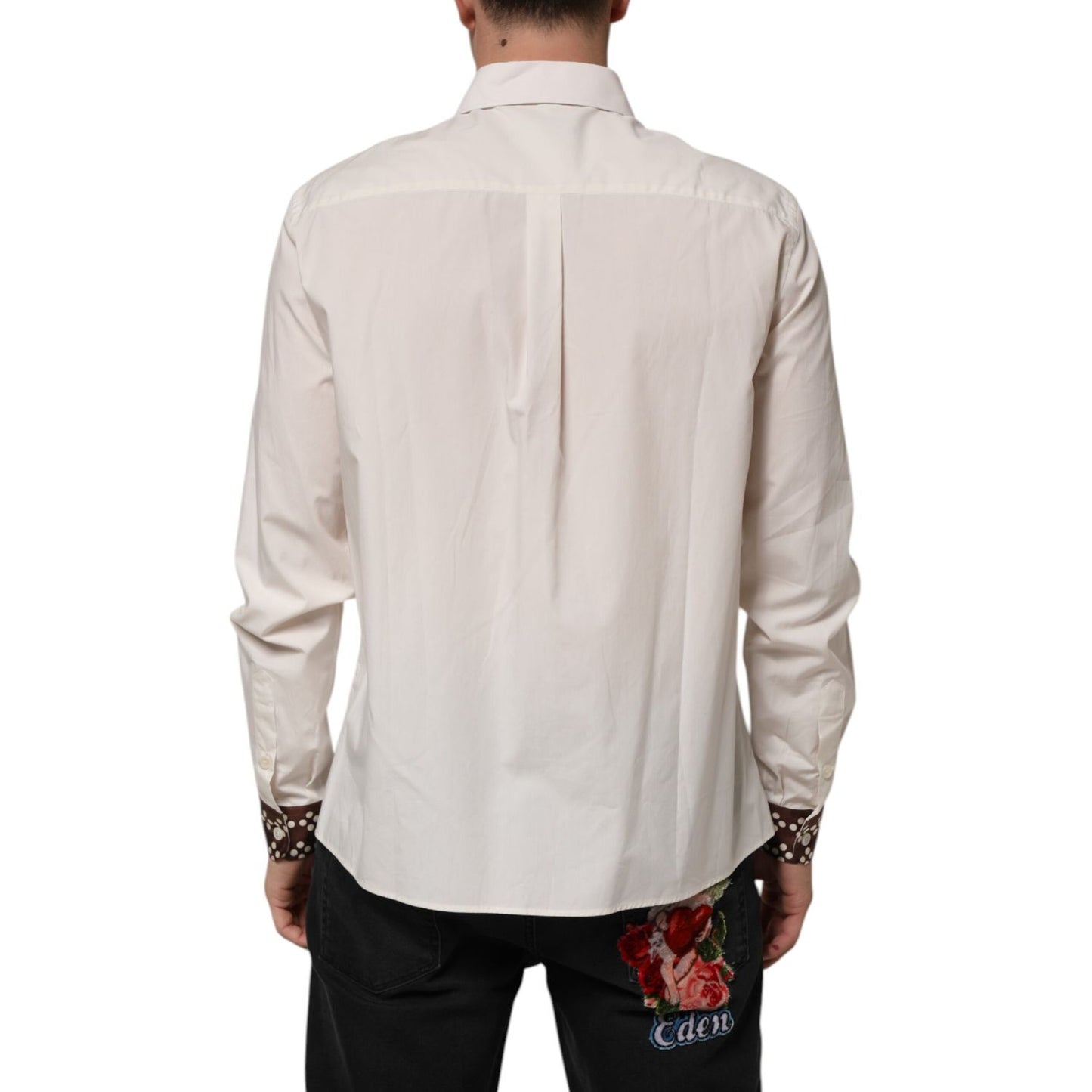 Back view of Dolce & Gabbana Cream White Cotton Polka Dot Slim Fit Shirt on male model, showcasing brown polka dot cuffs and Italian styling.