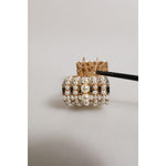Close-up of Dolce & Gabbana Gold Brass Glas Crystal Faux Pearl Embellished Brooch with intricate details and luxury design.