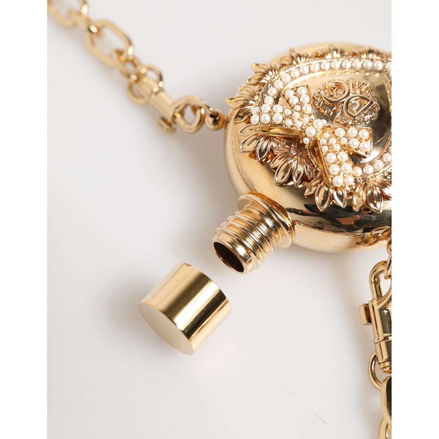Dolce & Gabbana Gold Brass Rhinestone Devotion Charm Pendant Necklace with lobster lock and minor dents on pendant back.