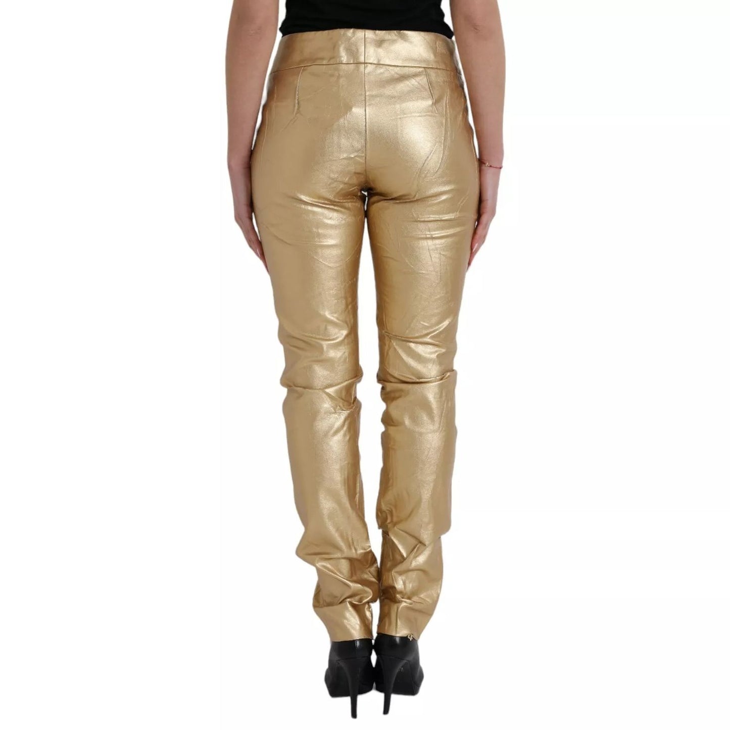 Back view of Dolce & Gabbana Gold High Waist Skinny Women Metallic Pants with logo details and zipper closure, made in Italy.