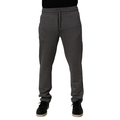 Dolce & Gabbana Gray Cotton Jogger Sweatpants Trouser Pants with elastic waistband and tapered silhouette, worn by model.