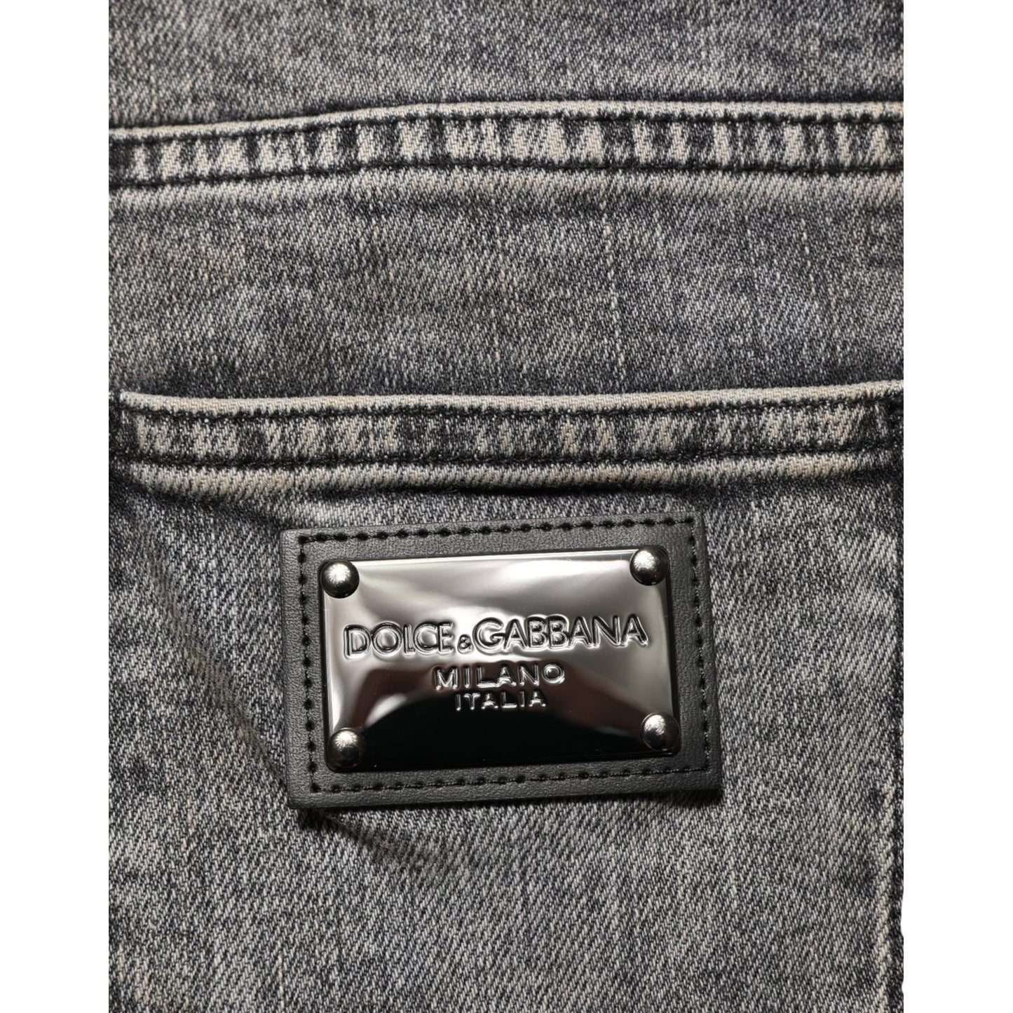 Close-up of Dolce & Gabbana Gray Cotton Stretch Slim Fit Men Denim Jeans with designer label detail.