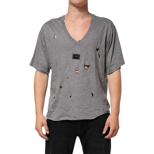 Dolce & Gabbana Gray Cotton Tattered Logo Patch Men T-shirt with distressed holes and black logo on chest, worn by a model.