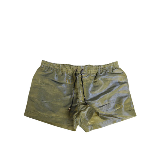 Dolce & Gabbana Green Polyester Metallic Logo Print Men Swimwear featuring drawstring closure and zipper pockets.